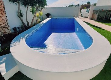 Alternative view of completed semi-inground pool. Built by Almeria Builders